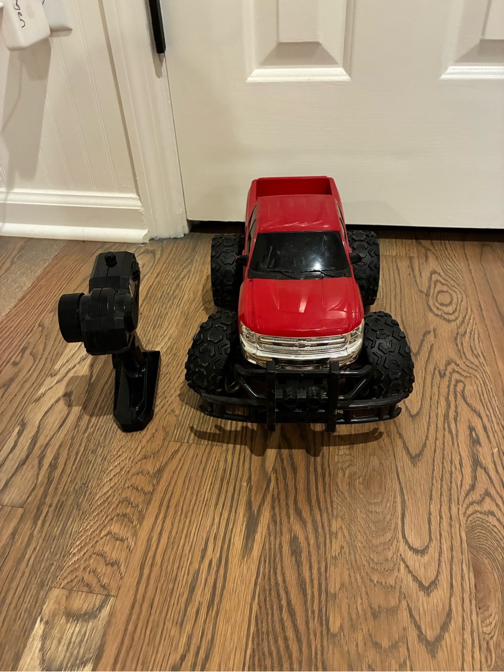 Red Remote Control Monster Truck with Large Off-Road Tires. Eztec